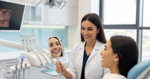 a dentist showing a patient a visibly whiter smile in a mirror after a teeth cleaning with whitening combo deals 2026.